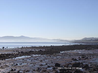 Inversion smoke haze in the Menai Strait on 10 December 2001. Note the mountain summits including Snowdon were clear. 