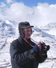 The author: Dr. Donald Perkins (FRMetS) making observations at the weather station but, sometimes, is out and about.