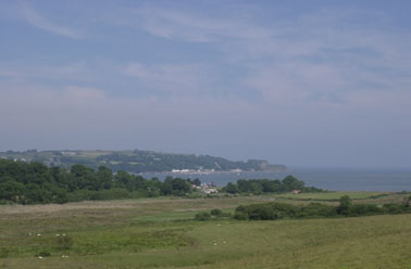 View across the Afon Nodwydd estuary to Traeth Goch (Red Wharf Bay) and the 'Ship Inn' on 5 July 2001. Photo: &copy; D. Perkins.